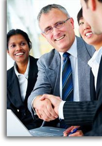 A business man shaking hands with another person.