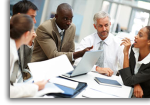 Business men and women at a meeting to discuss business.